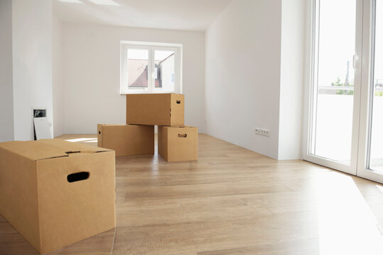 Empty room wooden floor new apartment boxes