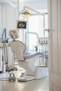 Dentist's chair facing screen with x-ray, Munich, Bavaria, Germany