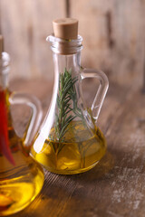 Obraz na płótnie Canvas Olive oil with pepper, rosemary and garlic