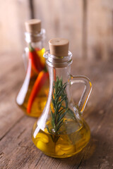 Obraz na płótnie Canvas Olive oil with pepper, rosemary and garlic