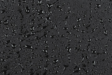 Water drops on dark stone