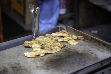 Frying bacon on the grill