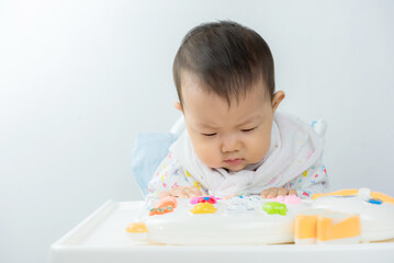 Baby sitting play in high chair,happiness baby,asian baby boy