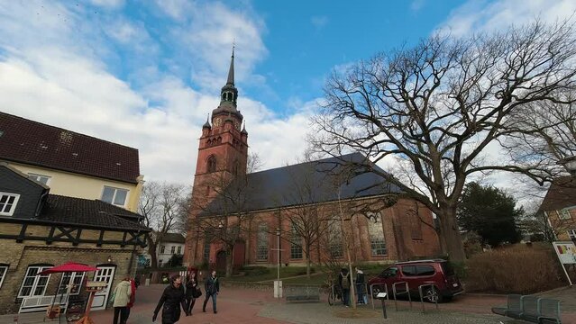 Church in the old city center with people walking around, lifestyle timelapse