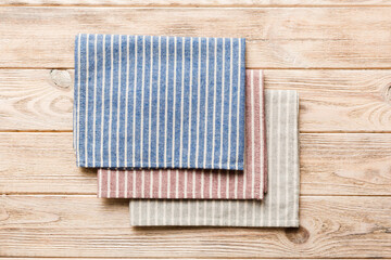 top view with blue kitchen napkin isolated on table background. Folded cloth for mockup with copy space, Flat lay. Minimal style