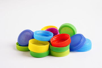 Plastic bottle caps colorful for recycle on white background.