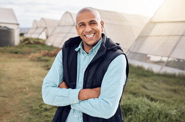 Black man, farmer and outdoor portrait with arms crossed, smile and happiness for sustainable farm. Farming expert, sustainability and happy in field by greenhouse with goals, vision and motivation