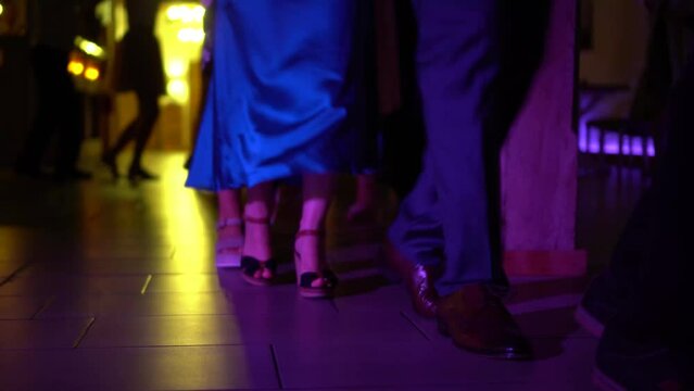 Dancing feet at a party forming a train