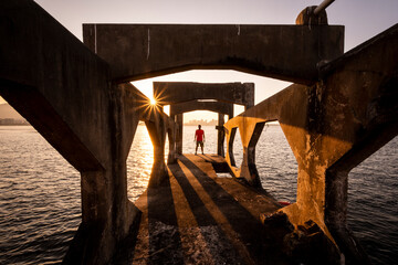 Man standing on the edge of old historic abandoned concrete structure