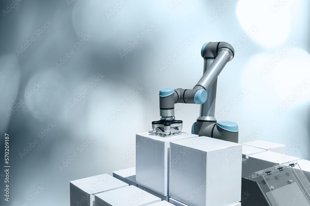 Poster robot arm with box on a gray background. smart industry 4.0 concept