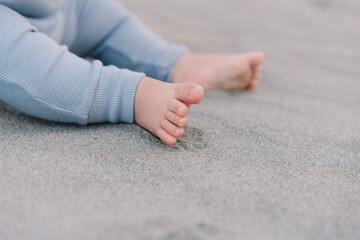 Barefoot baby feet on the sand