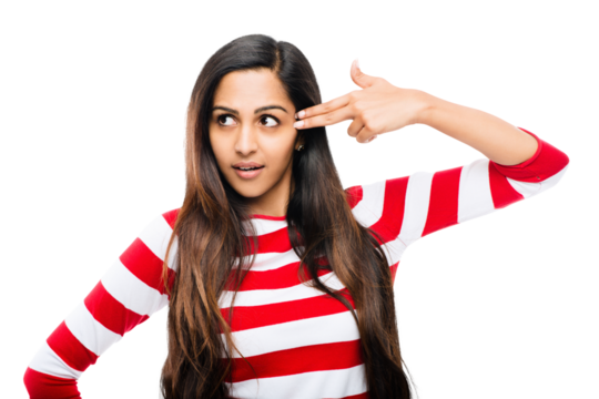 An attractive young girl making a gun gesture pointing on her head with her hands isolated on a PNG background.