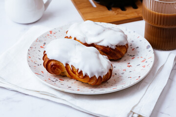 homemade eclairs with white vanilla glaze