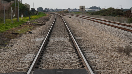 Obraz premium A view of the rails of a train. The length of the railway track. Israel