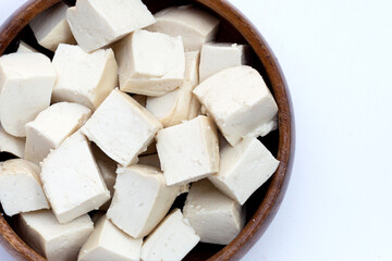 Fototapeta na wymiar White tofu in wooden bowl on white background.