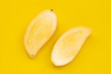 Tropical fruit, Mango on yellow background. Top view
