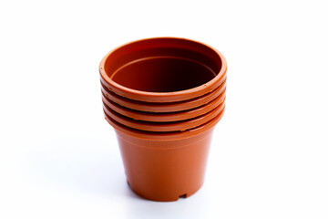 Plastic plant pot, container on white background.