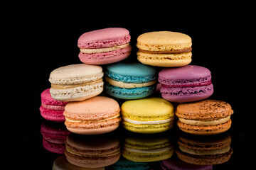 Colorful macaroon over black background