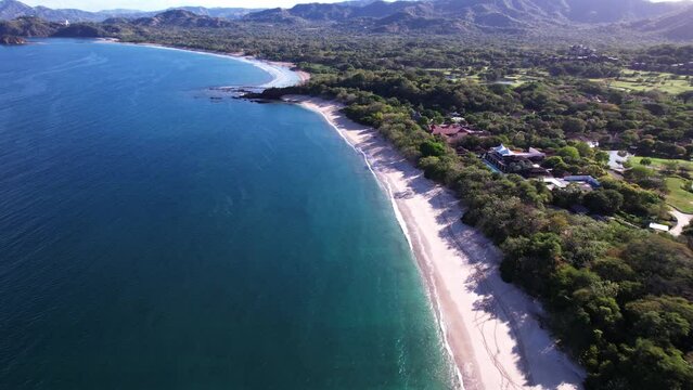 This is Playa Conchal, one of the best beaches in the world with white sand full of shells and crystal clear waters.