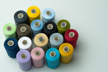 bobbins of sewing thread on white background