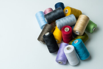 bobbins of sewing thread on white background