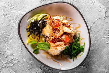 fish with Rice and Vegetable in bowl. donburi