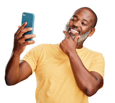 A contemplative trendy mature african american man taking a selfie on a smart phone isolated on a png background. Fashionable black man standing and posing while taking pictures for social media