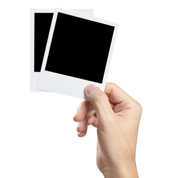 Hand with blank photo cards cut out
