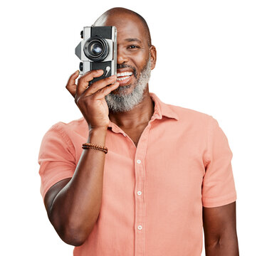 A happy African American man standing and taking pictures on a camera. Confident cheerful black man holding a camera and taking photographs. Smile and pose isolated on a png background.