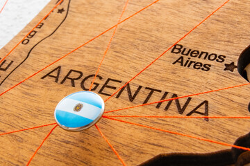 Argentina flag pins and red thread for traveling and planning trips. Planning of logistics routes...
