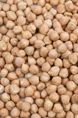 Background of dried chickpeas. Close up of chickpeas top vew. Vertical photo