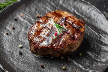 grilled steak filet Mignon on a dark background. Food recipe background. Close up