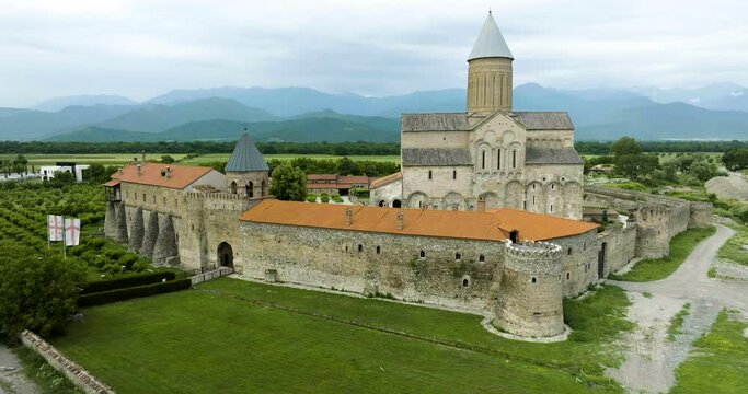 Alaverdi orthodox monastery with parking lot in georgian countryside.