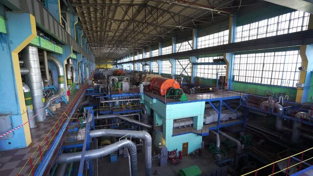 Inside a huge thermal power station, view of pipes and turbines, energy conversion system, environmental issues, power generation system, engineering structure, chp.