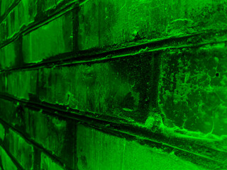 Fototapeta premium Vector green grunge background, gradient dark texture of an old brick wall. UHD 4K wallpaper. For screen, desktop, website design, overlay, stencil, banner, stylization and polygraph