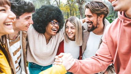 Multiracial happy friends having fun together outside - Group of young people enjoying day out -...