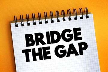 Bridge The Gap text on notepad, concept background