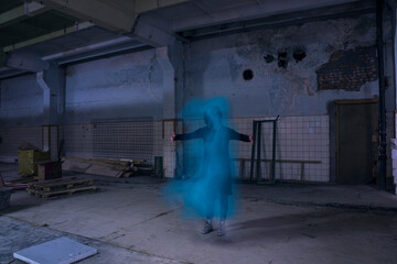 Obraz na płótnie Canvas Dancing with a Ghost in the darkindustrial building
