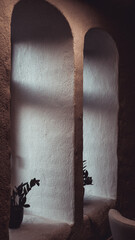 stone arch window with sunshine in an old building