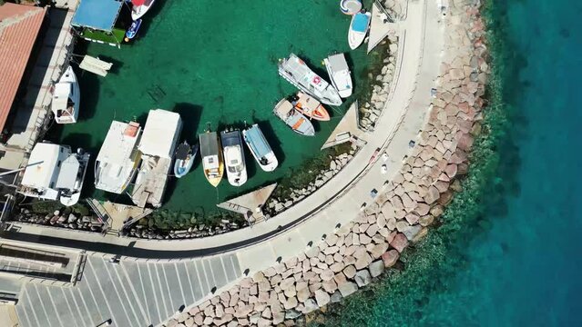 A drone view of a tropical marina with boats docking