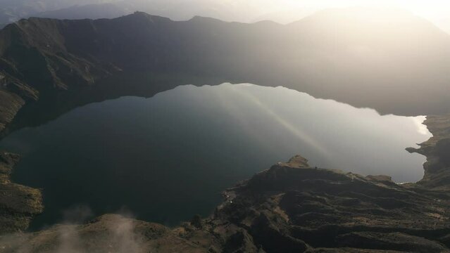 Aerial Drone Above Quilotoa Crater Ecuatorian Water Volcano, Indigenous Highland Peak, Golden Sunlight in Travel Destination, Ecuador, South America