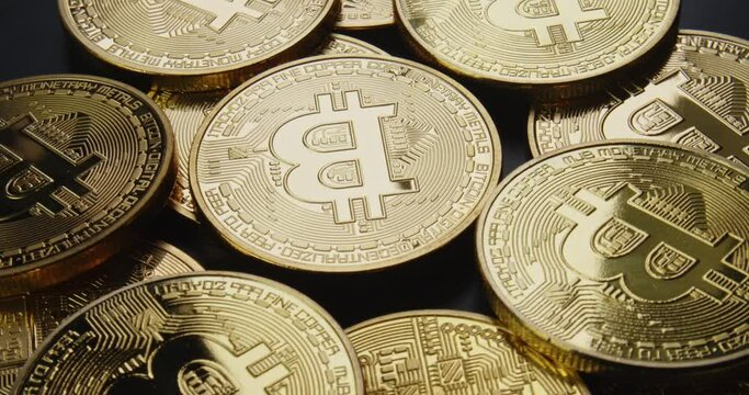 Close up of a pile of real physical crypto Bitcoin or cryptocurrency BTC coins