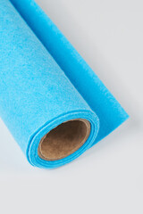 Soft felt textile material Airy Blue colors, colorful texture fabric roll closeup