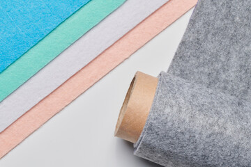 Multi-colored soft felt textile material, colorful patchwork texture fabric close-up