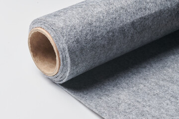Soft felt textile material gray color, colorful texture fabric roll closeup