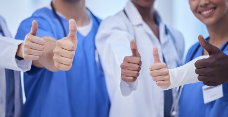 Healthcare, teamwork and group of doctors with thumbs up, hands together, collaboration and...