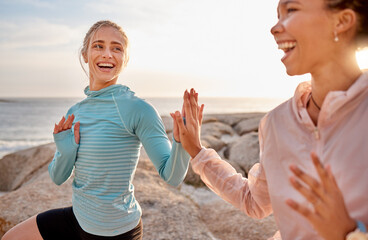 High five, spiritual and friends doing a meditation at the beach for health, mind and zen in Bali. Teamwork, laughing and women with hands for connection during an exercise for peace by the sea