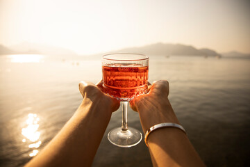 woman drinking cocktail on the beach