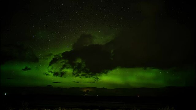Timelapse of the incredible green Aurora Borealis on show at night in the Scottish Highlands
