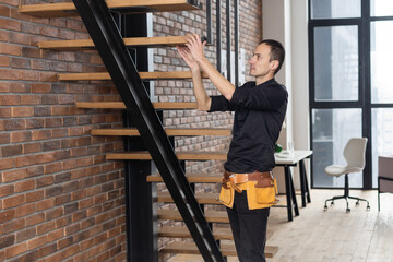 the worker is repairing the stairs